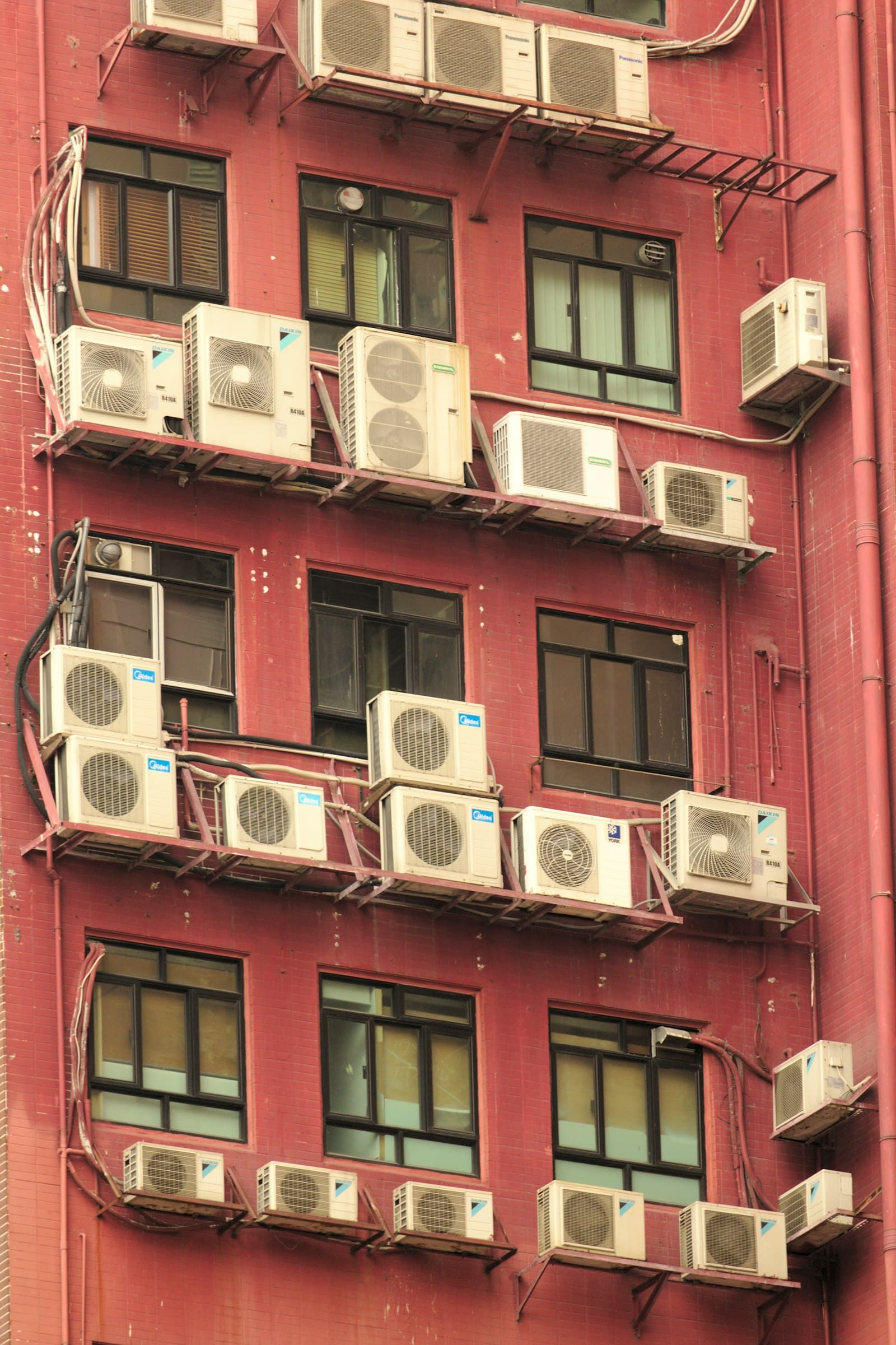 Rows of outdoor air conditioning units on a building