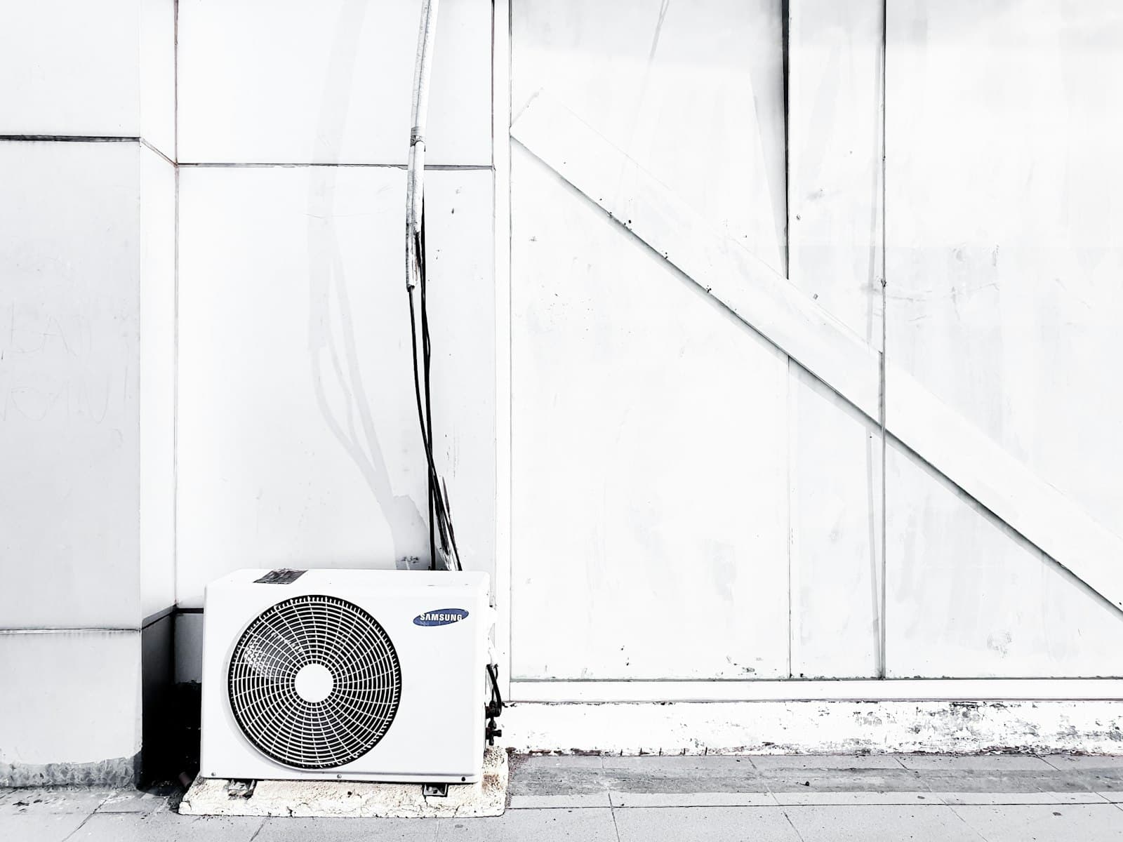 Outdoor air conditioning condenser installed at a residence